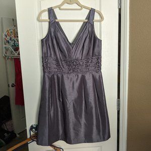Shimmery silver dress with waist detail. Pockets!